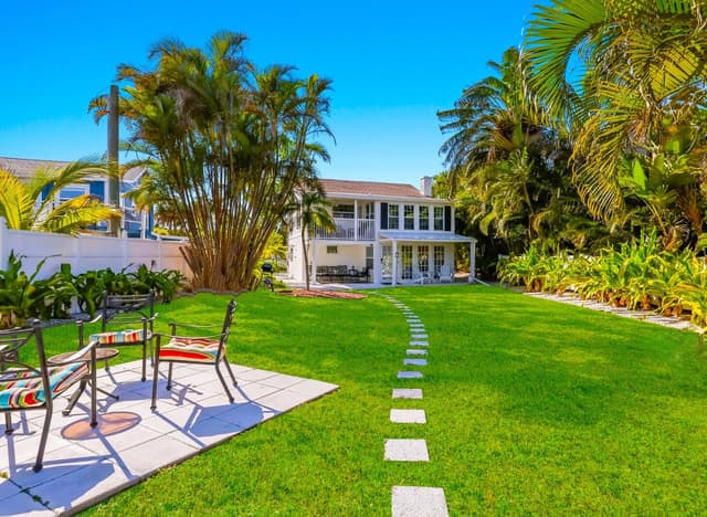 Private tropical backyard, with outdoor seating