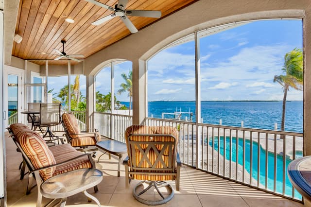 Balcony with dining table and chairs