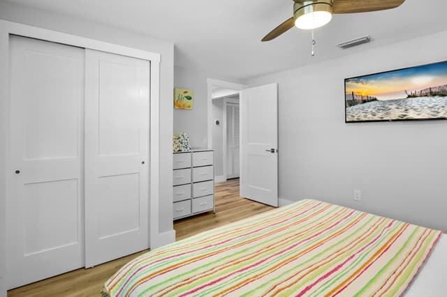 Spacious primary bedroom with king bed.