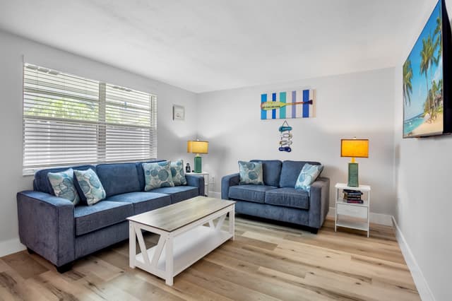Bright and comfortable living room, perfect for relaxing after a beach day.