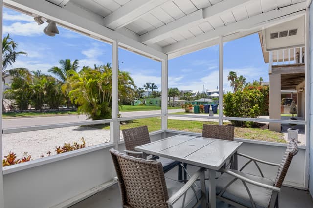 Relax and enjoy outdoor dining in the screened patio.