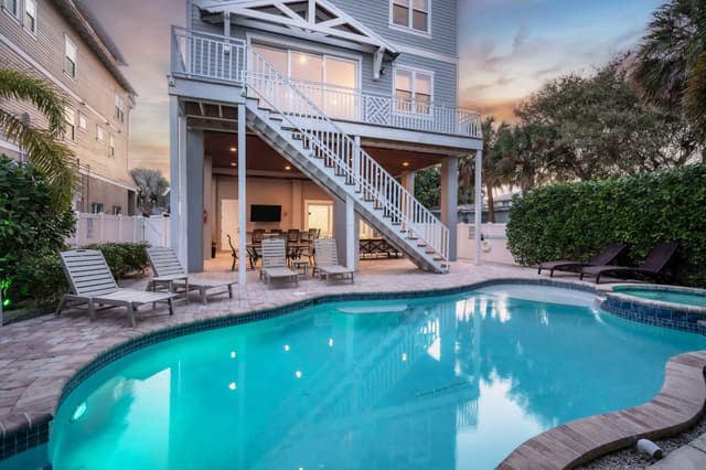 House featuring pool and spa amenities