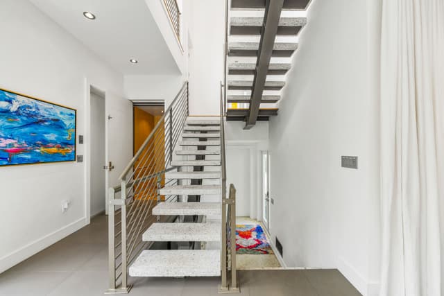 Entrance Foyer-Floating Staircase & Elevator to All Floors