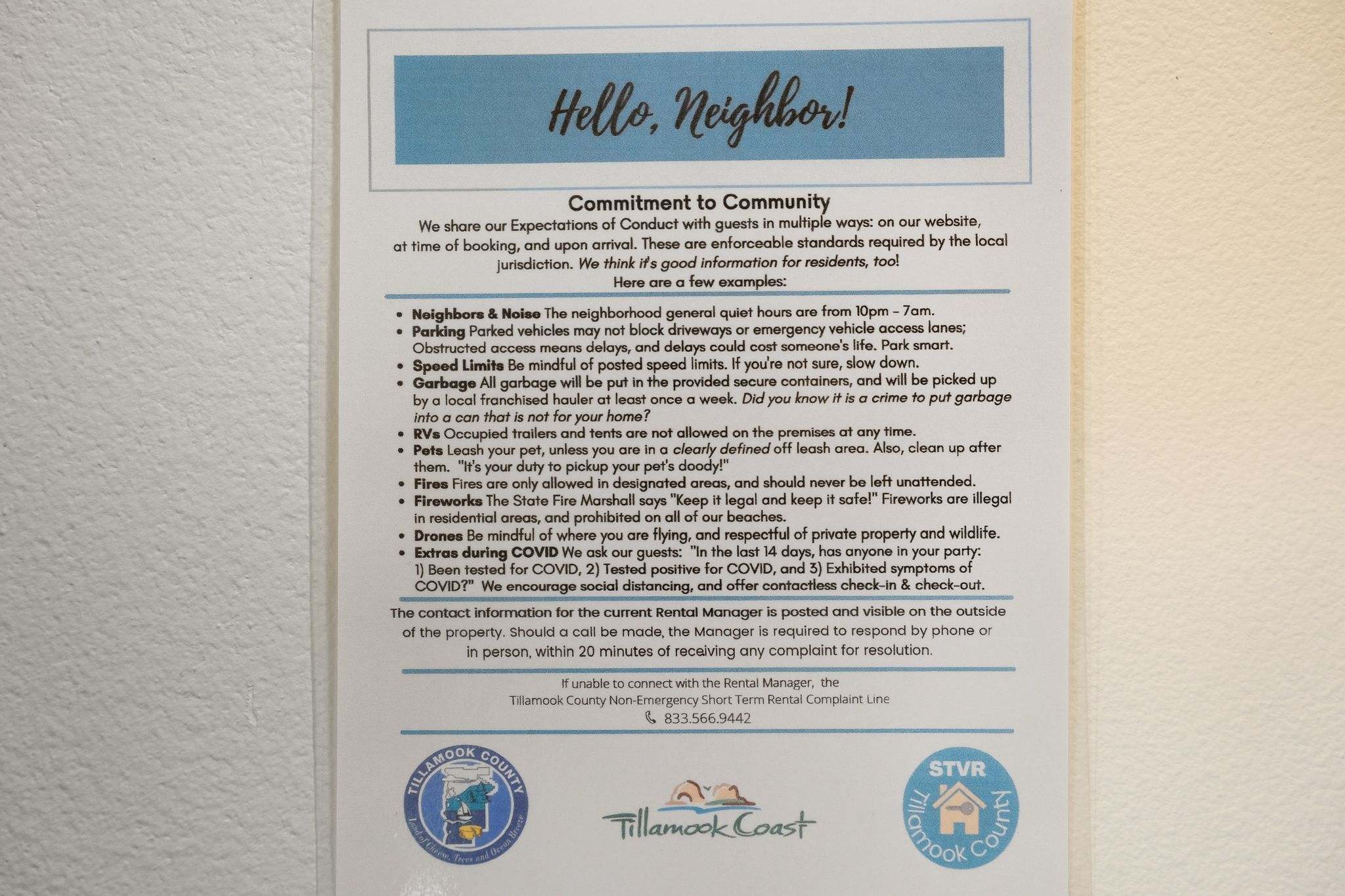 An informational sign titled "Hello, Neighbor!" outlines community guidelines for guests, covering topics like noise, parking, pets, and local regulations. It includes contact information and tourism logos.