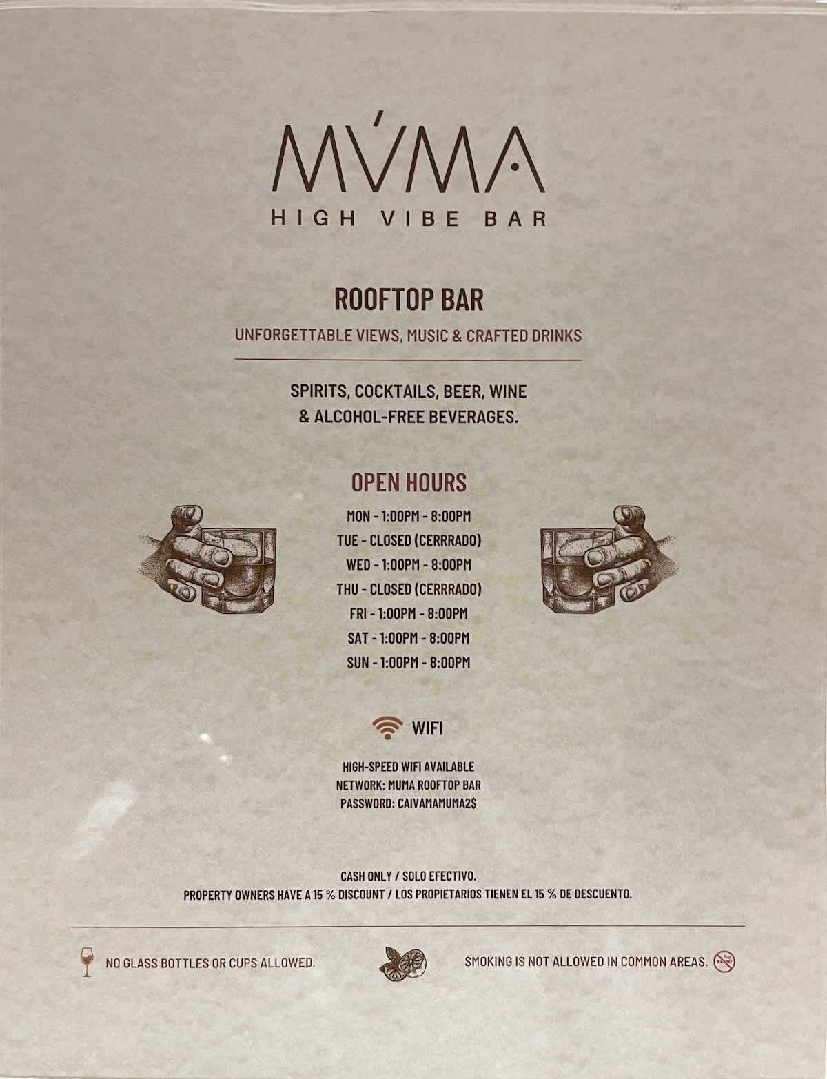 A detailed sign for 'MVMA High Vibe Bar' on the rooftop, listing open hours, drinks offered, WiFi details, and a discount for property owners.