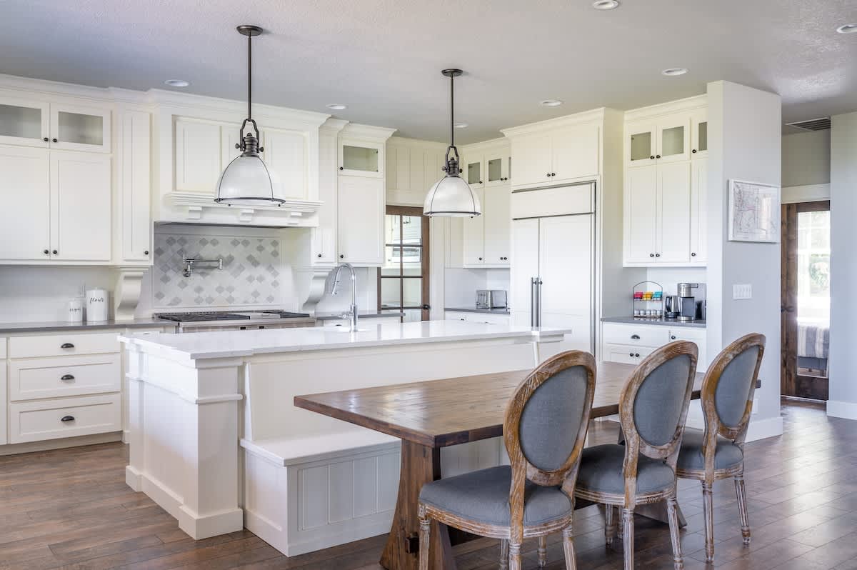The kitchen tables comfortably seats eight. There are extra chairs and a high chair in the pantry for easy access.