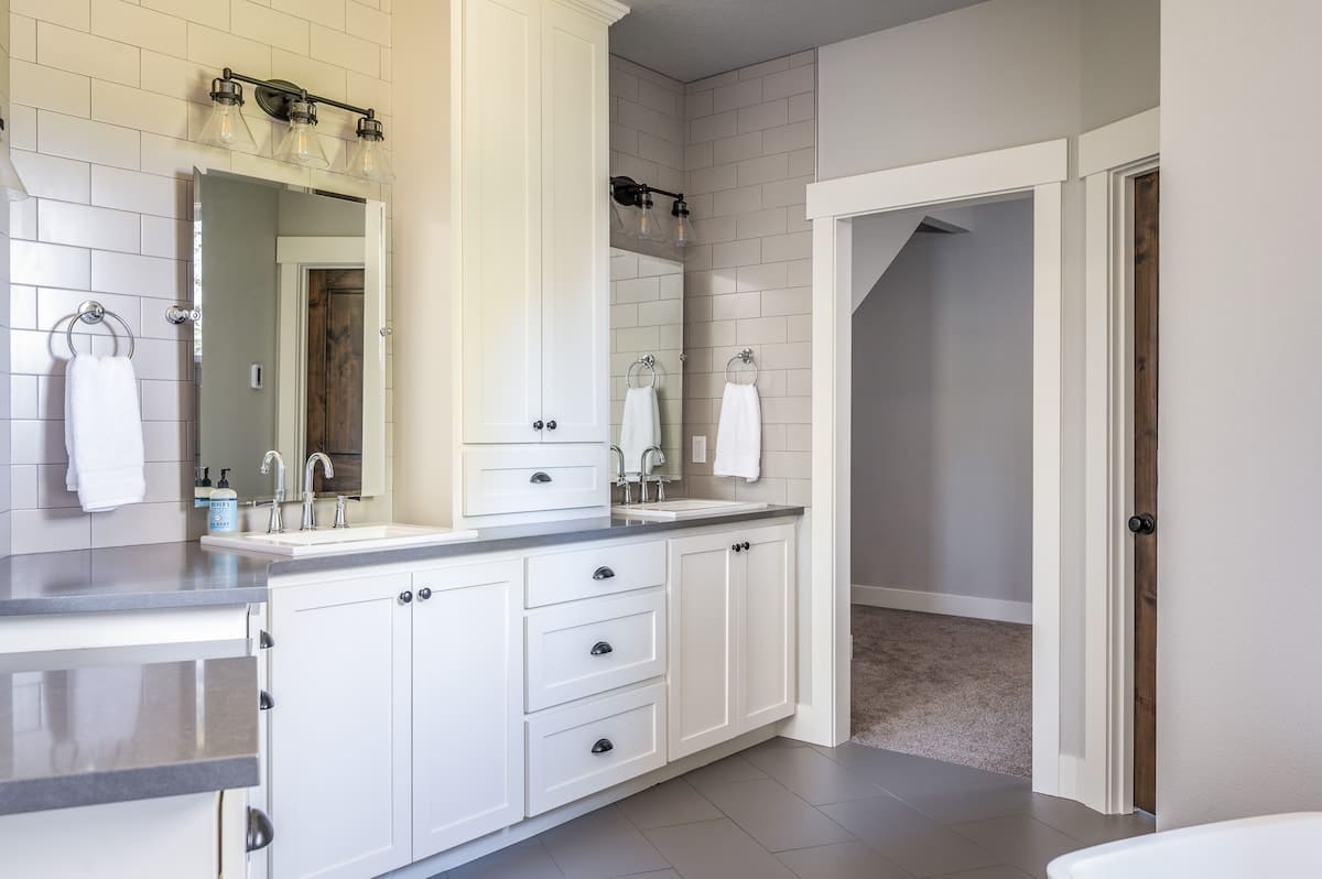 Three vanities plus an oversized walk-in closet, a dream bathroom, especially for an extended stay!