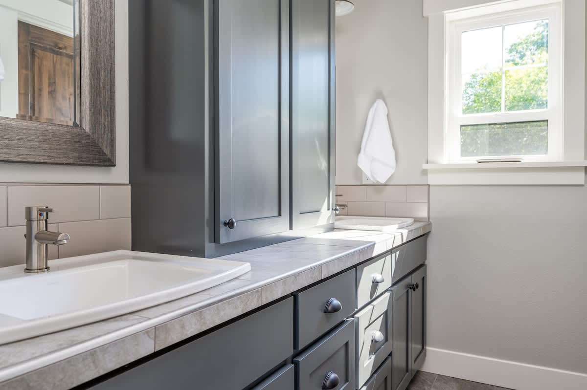 The upstairs bathroom has two sinks plus a full walk-in shower.