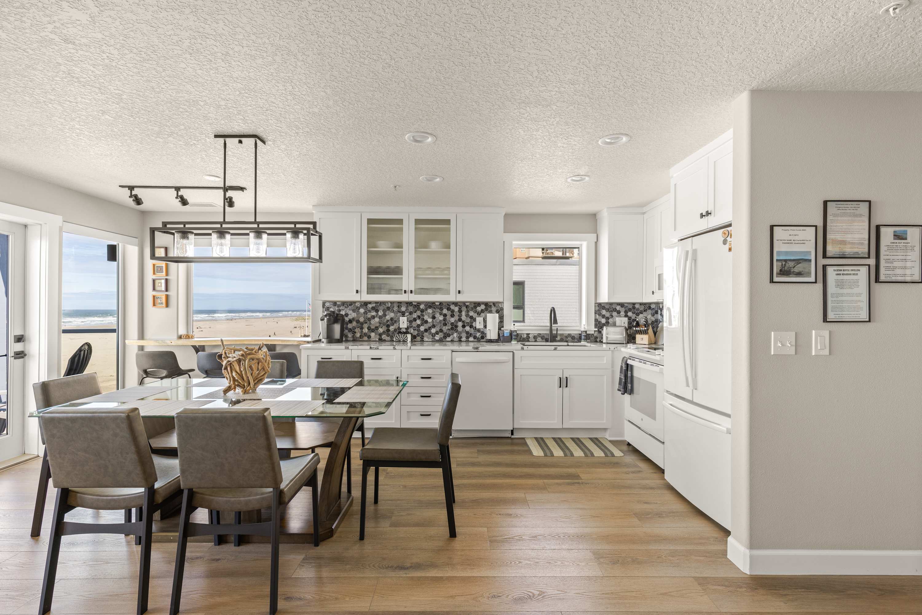 Fully equipped kitchen with dining space and breathtaking ocean views for the ultimate beachfront experience.