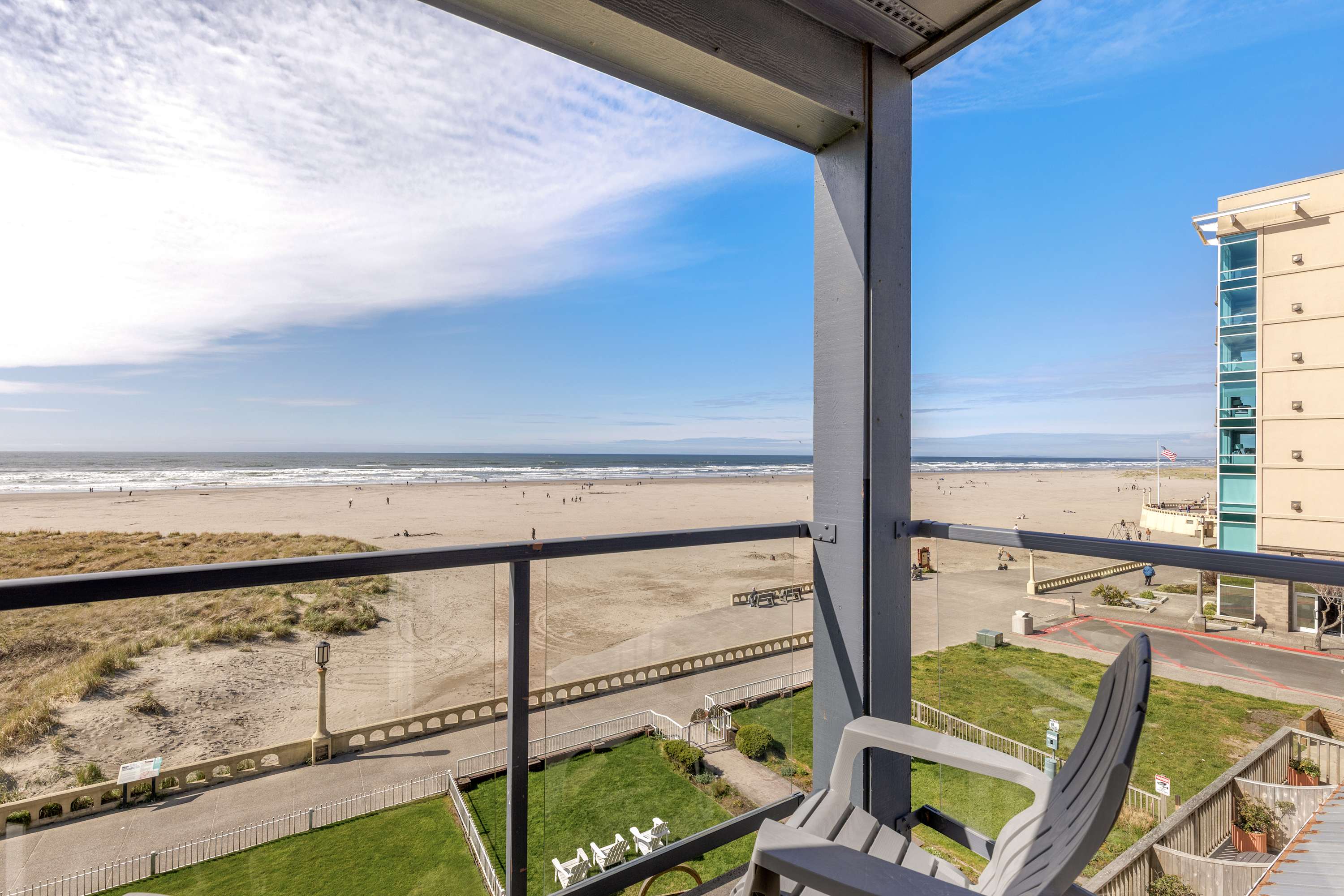 Enjoy unobstructed oceanfront views from this private balcony with seating and a prime beachfront location.
