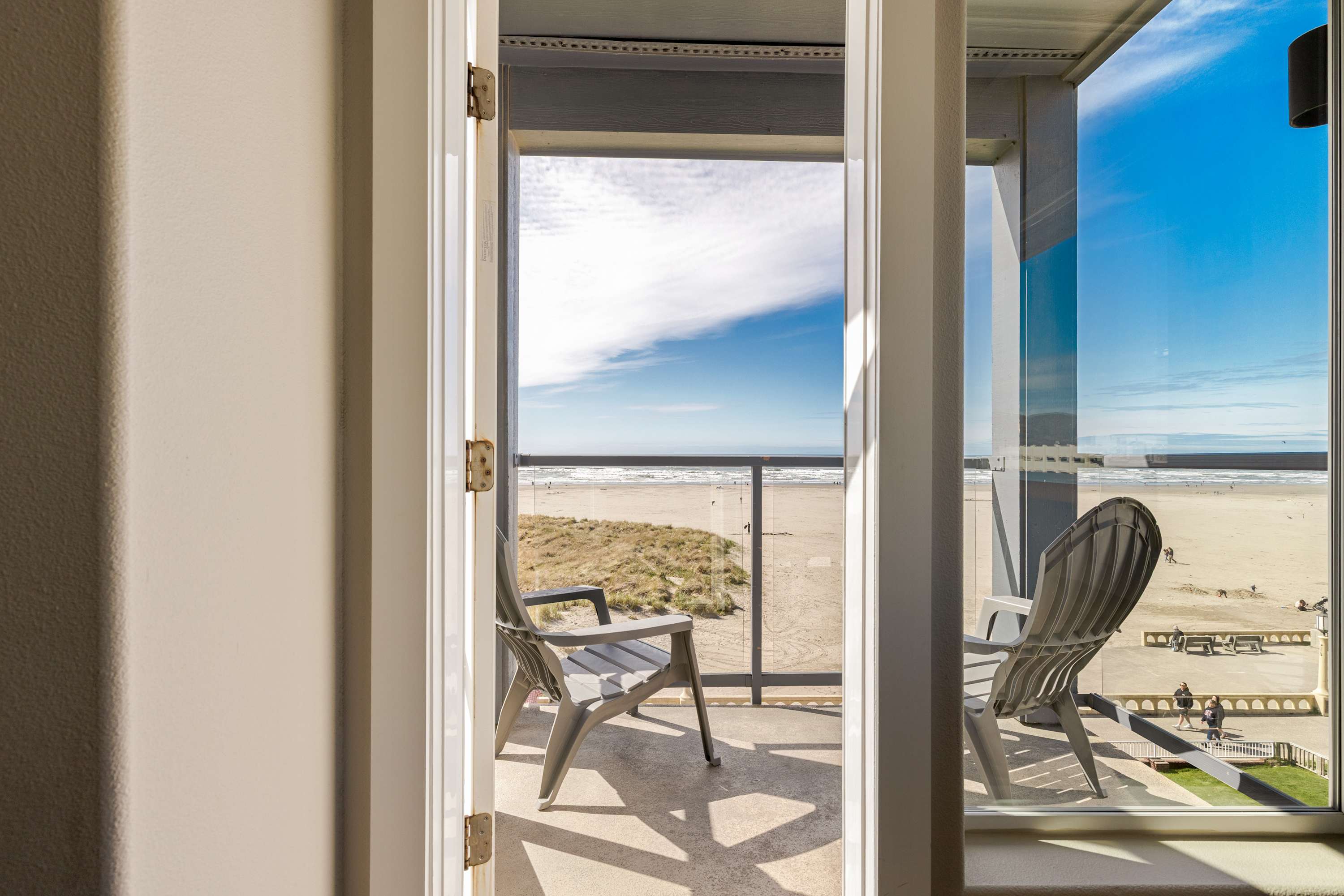 Step through to your private balcony with seating and direct ocean views—perfect for enjoying fresh air and coastal sunsets.