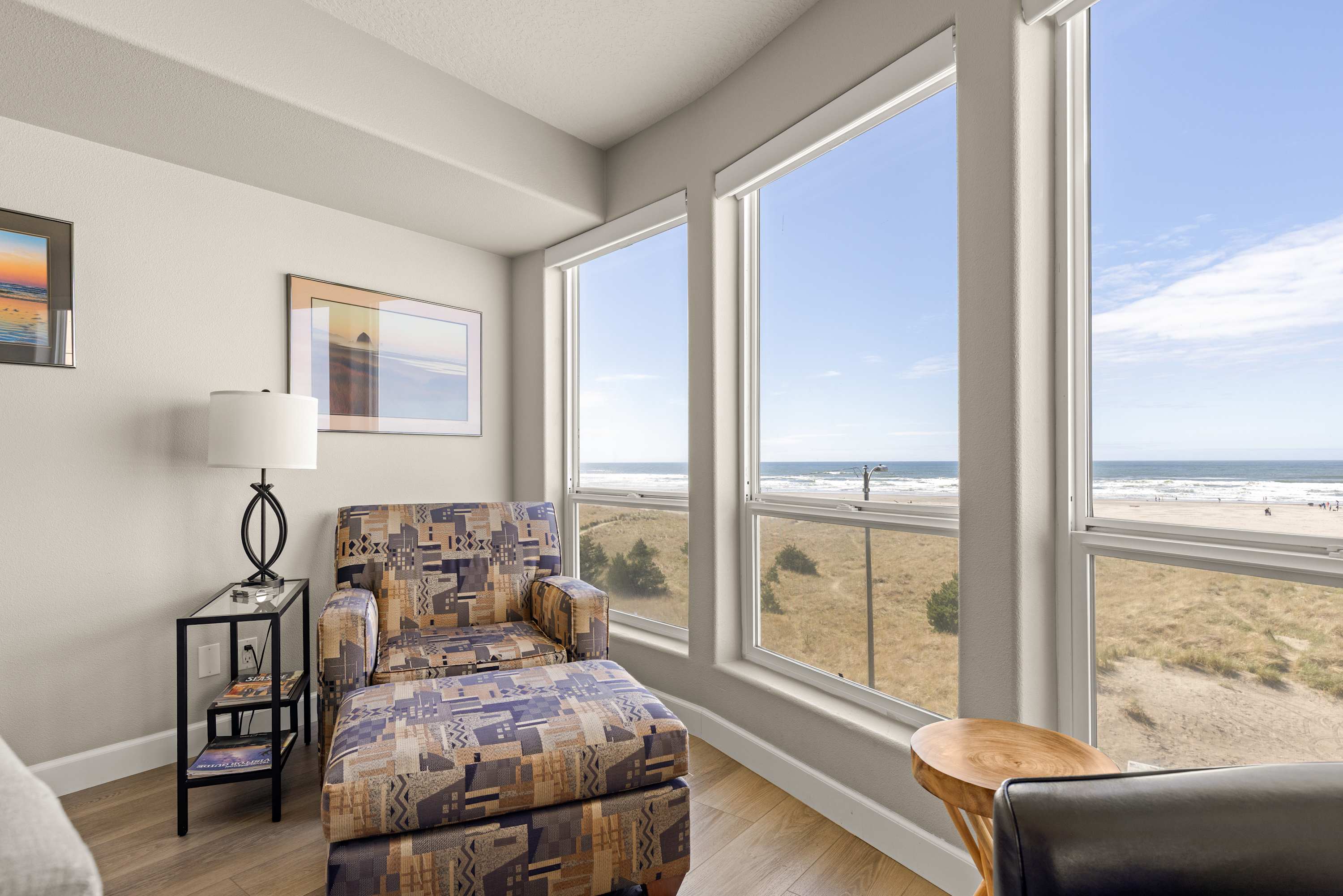 Cozy reading nook with comfortable chair and stunning ocean views—perfect for relaxing with a book while watching the waves.