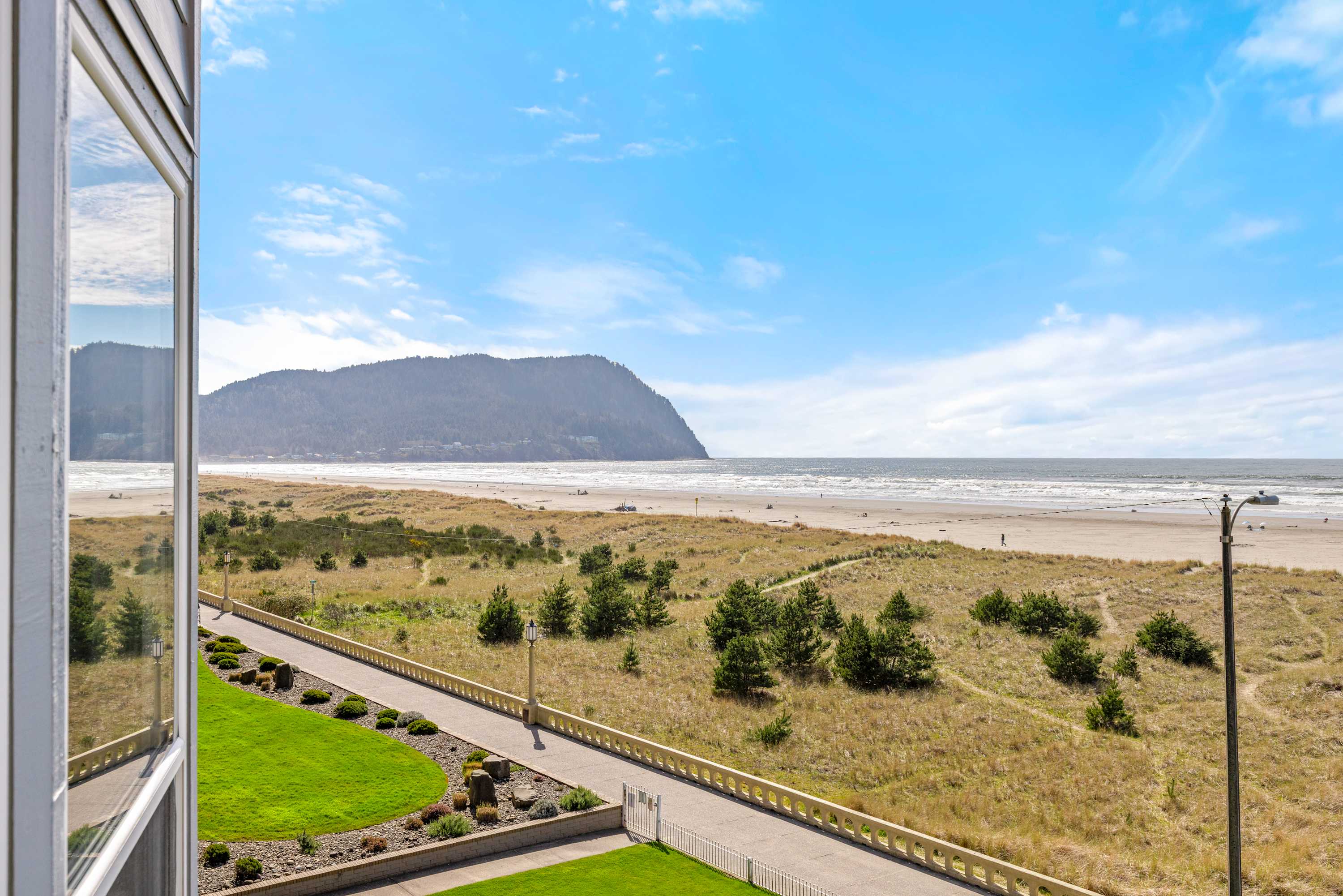 Beautiful coastal landscape with beach, dunes, and ocean views creating a relaxing and scenic getaway.