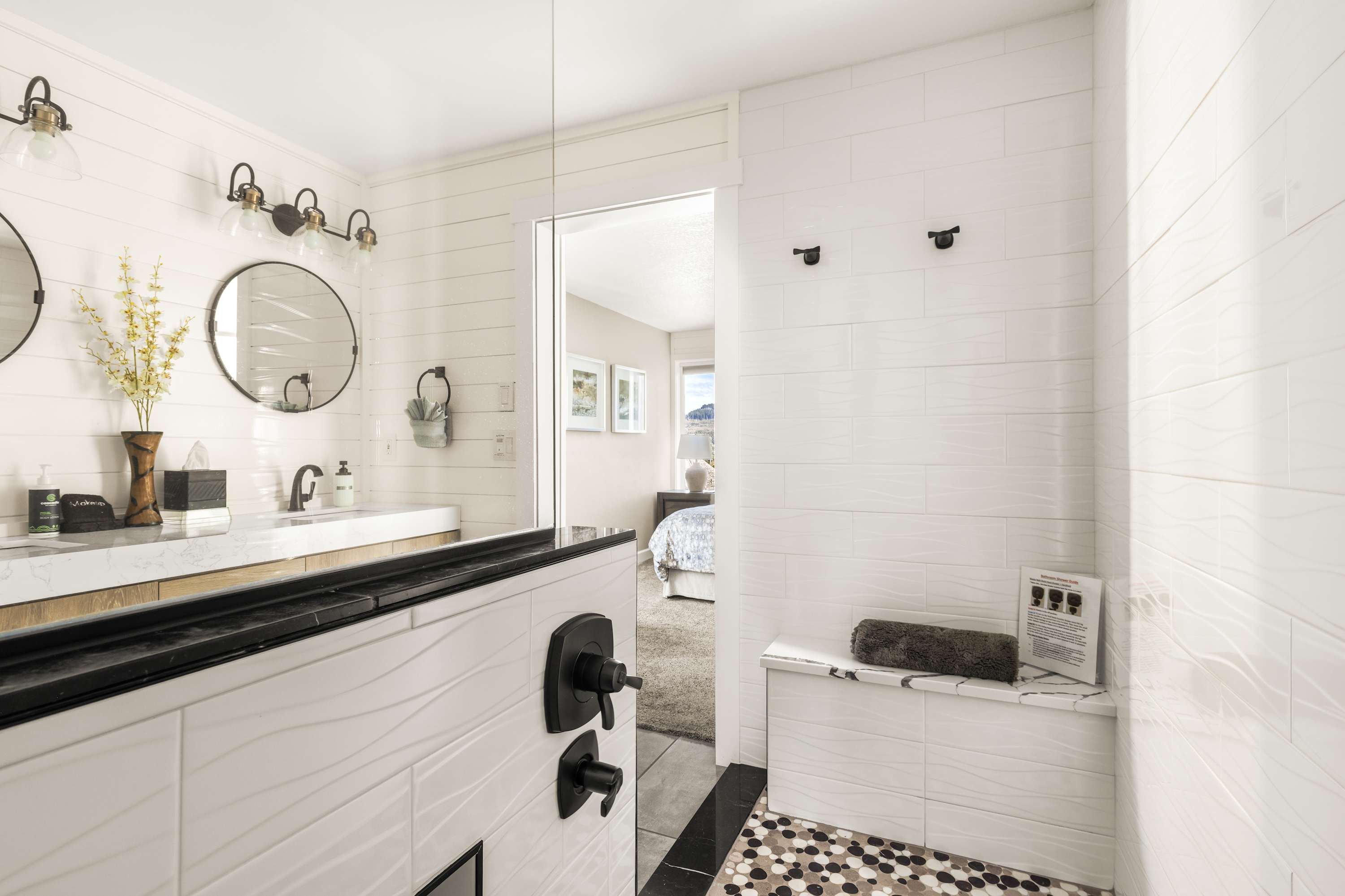 Relax in a bright bathroom with contemporary finishes and open, airy layout.