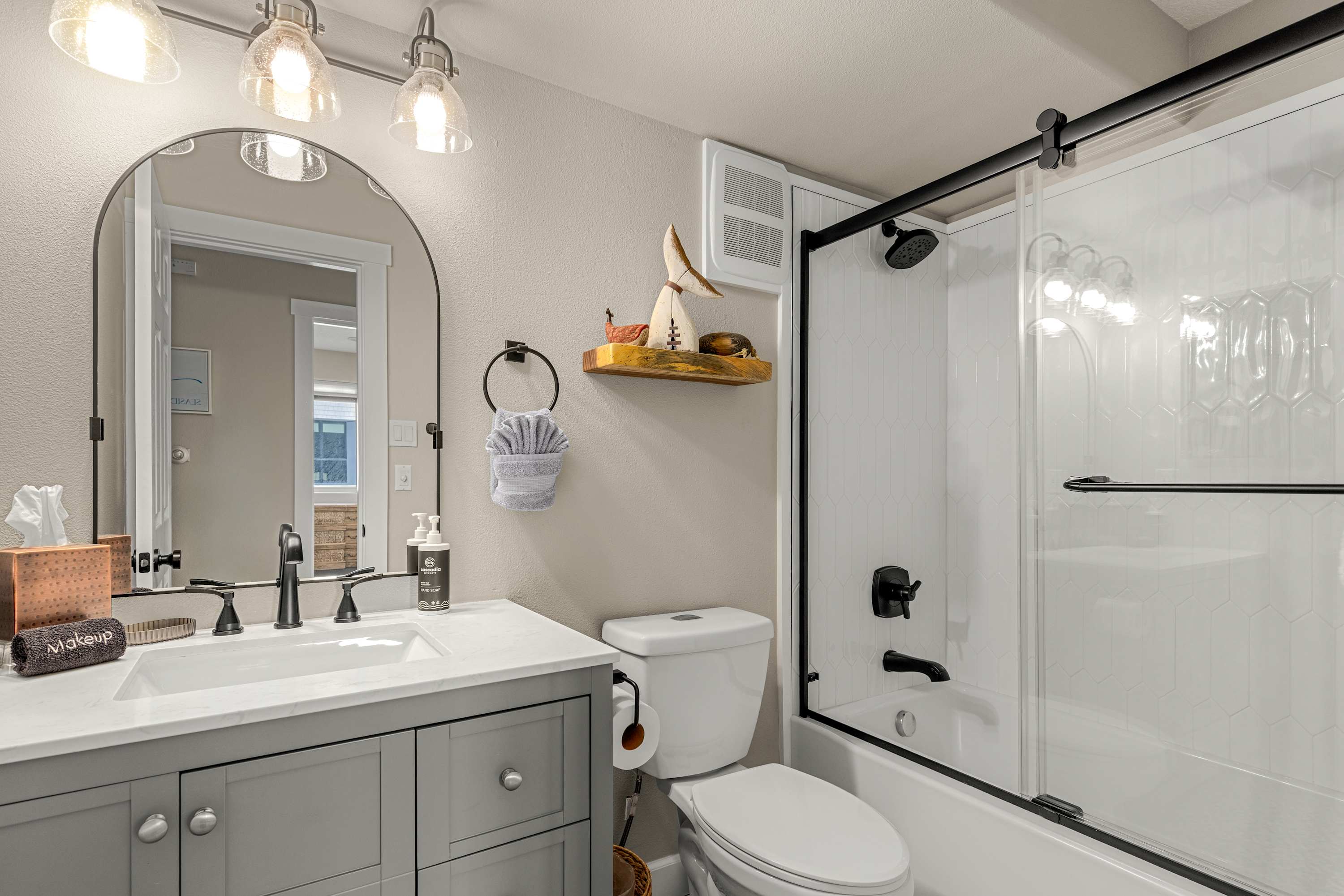 Fresh, clean bathroom just steps from your cozy king bed, perfect for unwinding after a long day.
