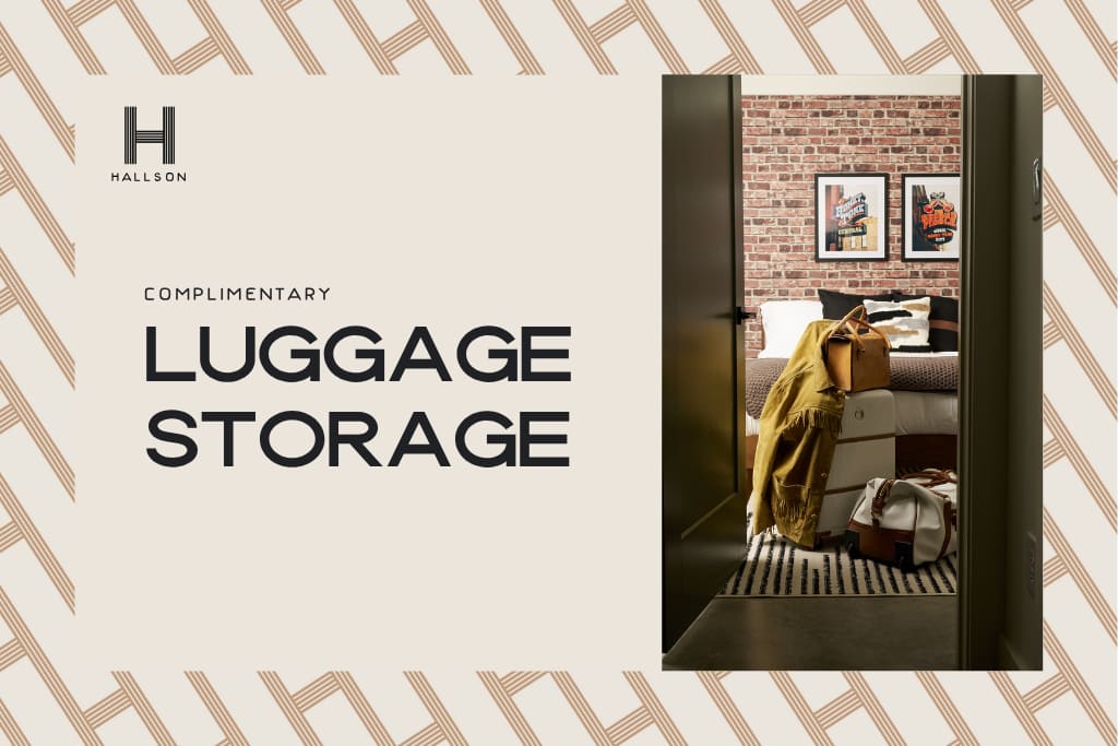 A promotional image with text 'COMPLIMENTARY LUGGAGE STORAGE' next to a stack of luggage and a jacket in a room with a brick accent wall. The background features a geometric pattern.