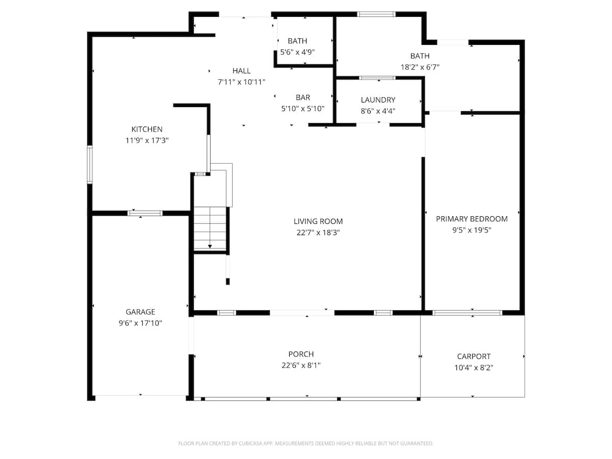 Detailed floor plan illustrating the first floor layout of a house, showing rooms like kitchen, living room, primary bedroom, garage, and two bathrooms with dimensions.