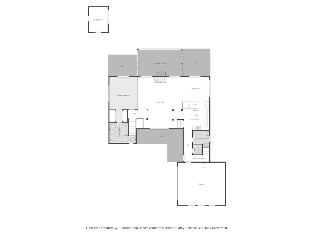 Main level floor plan diagram featuring a primary bedroom with en-suite bath, living room, kitchen, dining area, screened porch, deck, laundry/pantry, and garage. A garden shed is also indicated outside.