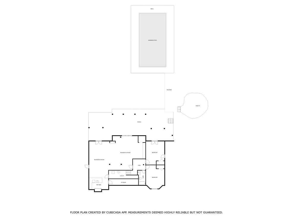 Floor plan of a lower level featuring a large recreation room, two bedrooms, a bathroom, wet bar, and storage. The exterior layout includes a swimming pool, fire pit, and a balcony/walkway.