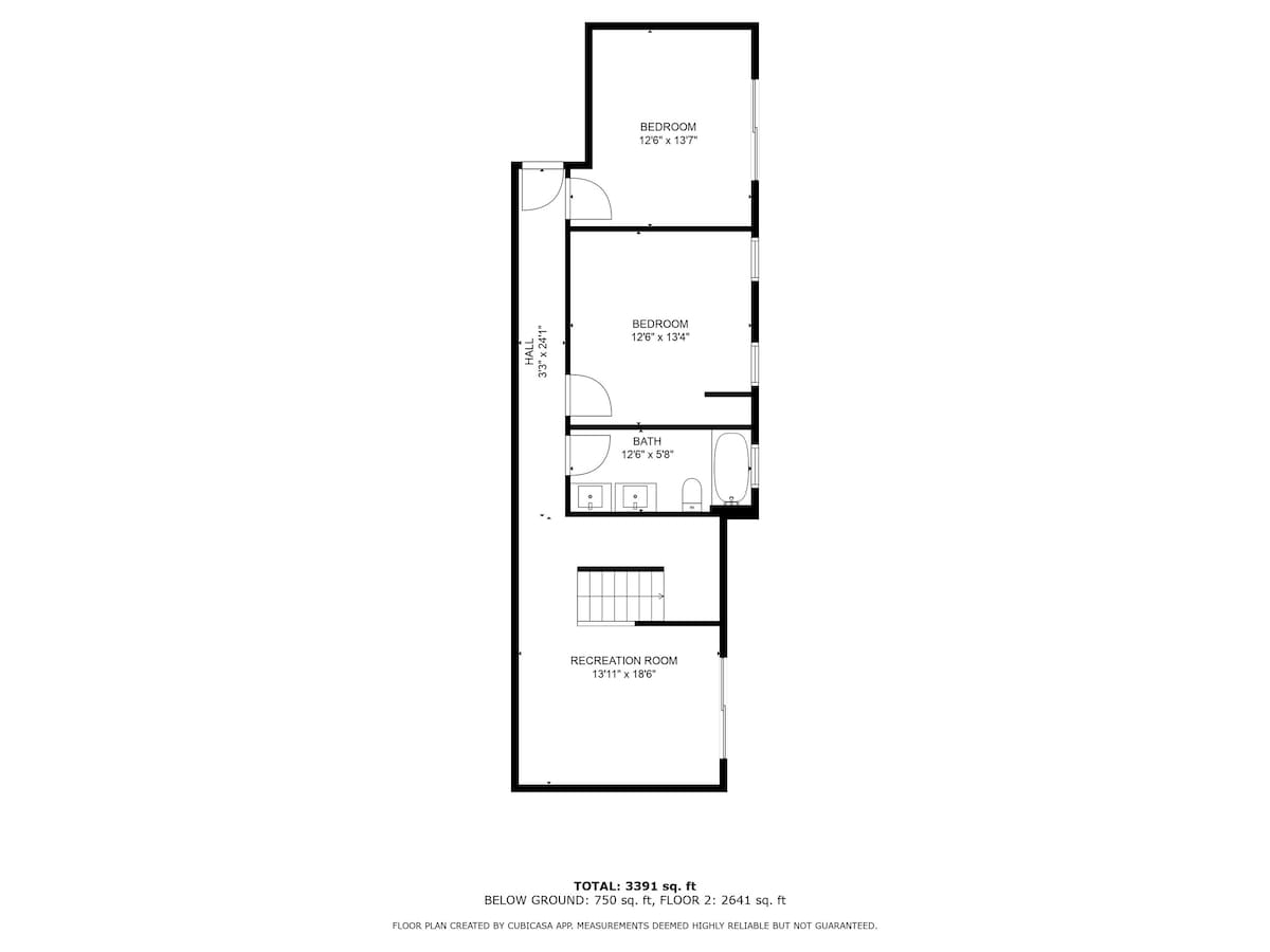 A black and white floor plan illustrates the lower level of the house, detailing a recreation room, a bathroom, and two bedrooms with their dimensions. The total square footage for the ground and second floor is also indicated.
