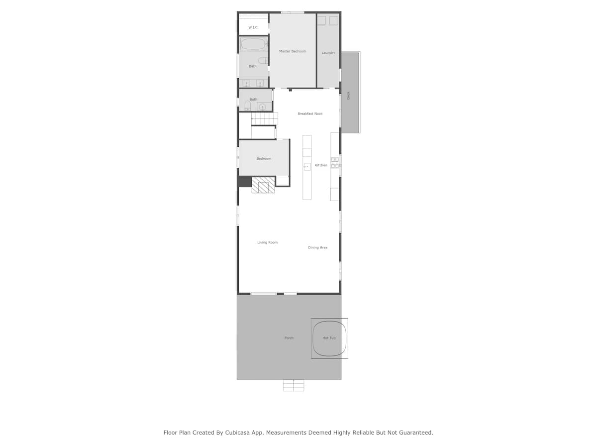 A clear floor plan illustrates the first floor's arrangement, featuring a living room, dining area, kitchen, breakfast nook, bedroom, master bedroom with walk-in closet and bath, laundry, and an outdoor porch with a hot tub.