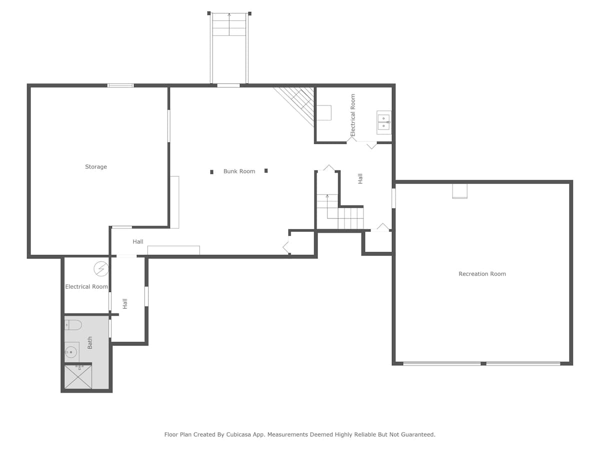 Detailed floor plan of the basement level, featuring a large recreation room, a bunk room, storage areas, an electrical room, a hall, and a bathroom with a shower and toilet.
