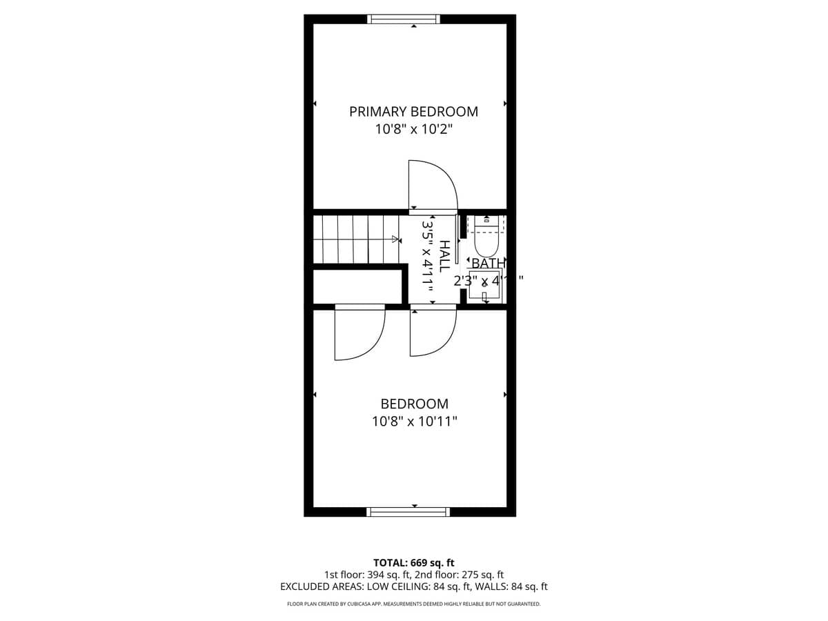 Detailed floor plan illustrating the layout of the second floor, featuring a primary bedroom, a second bedroom, a hall, and a small bathroom, with dimensions provided.
