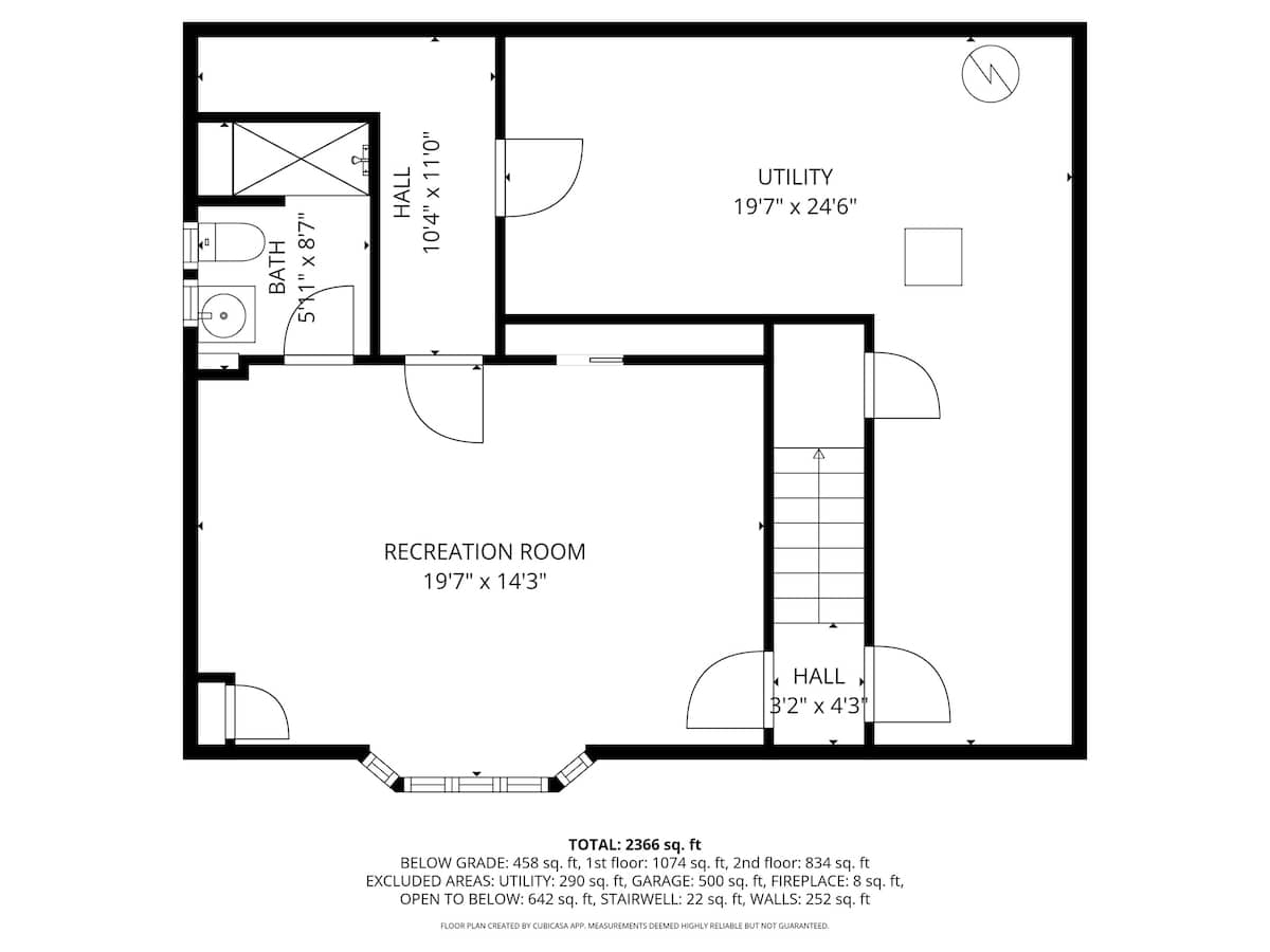 A detailed black and white floor plan illustrates the below-grade level of the house, showing the layout of a recreation room, utility room, hall, and a bathroom with dimensions.