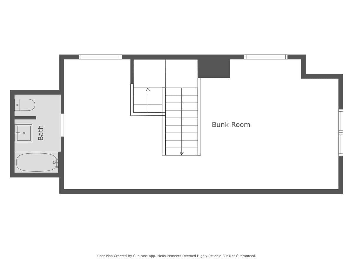A floor plan of a lower level or upper level features a "Bunk Room" and an adjacent bathroom with a toilet and bathtub. Stairs are centrally located, indicating access to another floor.