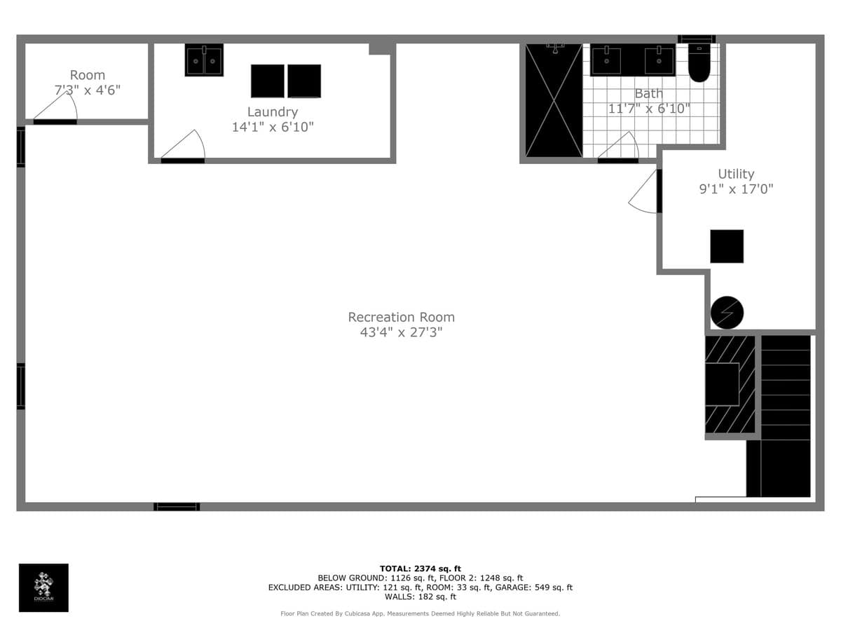 A black and white floor plan diagram of the basement level, detailing a large recreation room, laundry area, utility room, and a bathroom, with all room dimensions clearly provided.