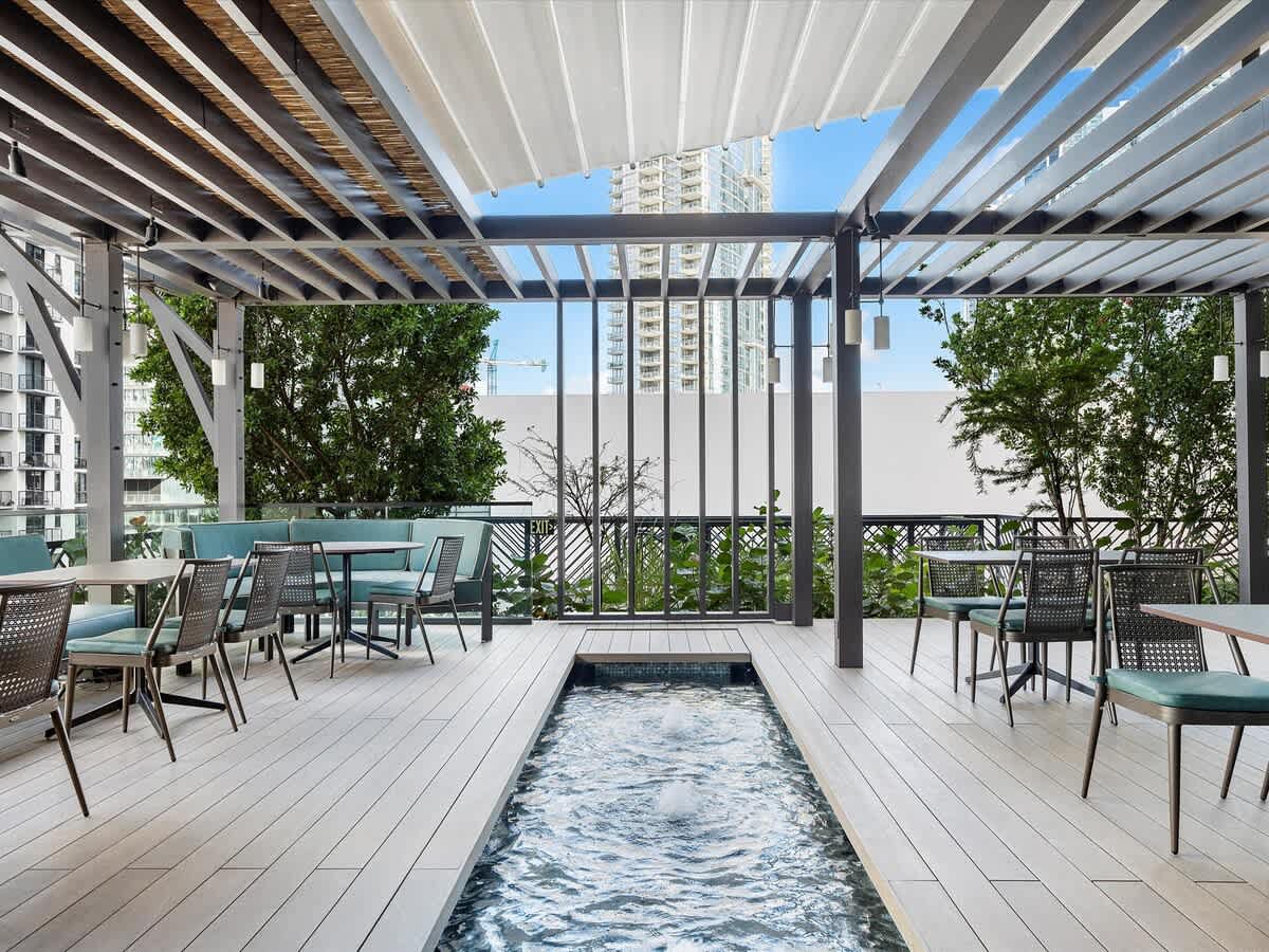 Patio, Sleek Urban Apartment - Walk to Kaseya Center