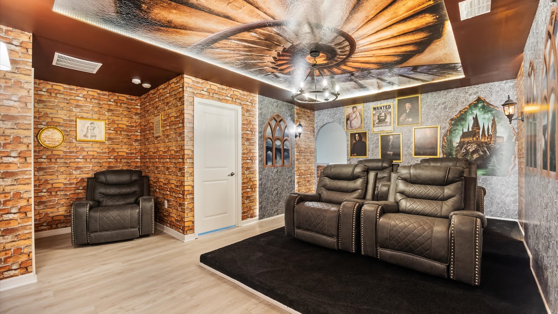 Harry Potter-themed home theater with two rows of reclining cinema seats, brick and stone-patterned walls, and a dramatic ceiling mural, creating an immersive viewing experience.