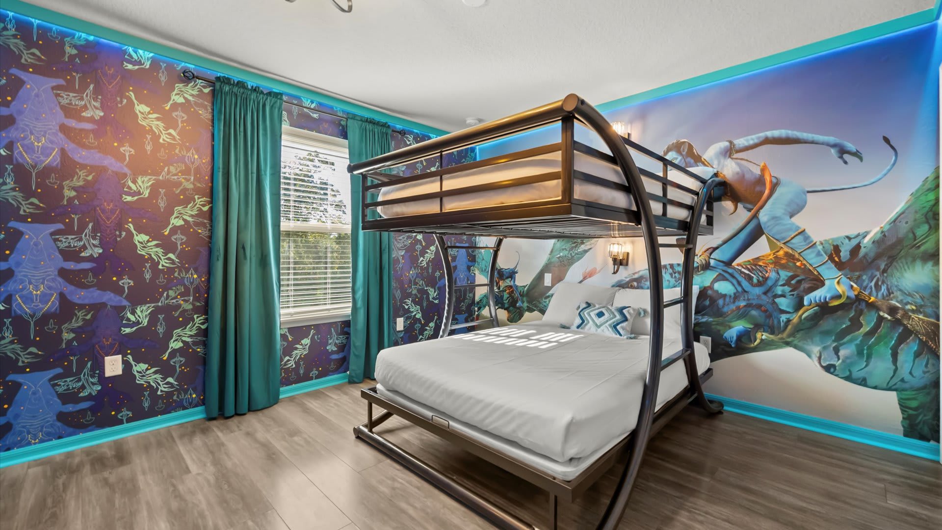 An Avatar-themed bedroom with a metal bunk bed (full over full), vibrant blue and purple patterned wallpaper, and a large mural of an Avatar character on the accent wall.